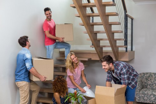 Removal van and moving team in Battersea street setting