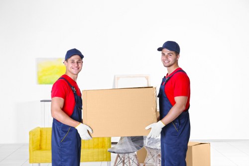 Furniture being carefully moved from a Battersea flat with stairs and tight access