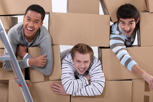Professional movers handling boxes and furniture in Battersea
