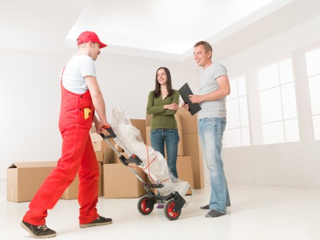 Battersea removals crew planning a safe lifting route in a property
