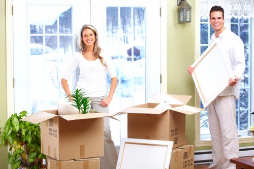 Careful loading of boxes and furniture into a van in Battersea