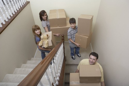 Local movers carrying boxes during a Battersea relocation